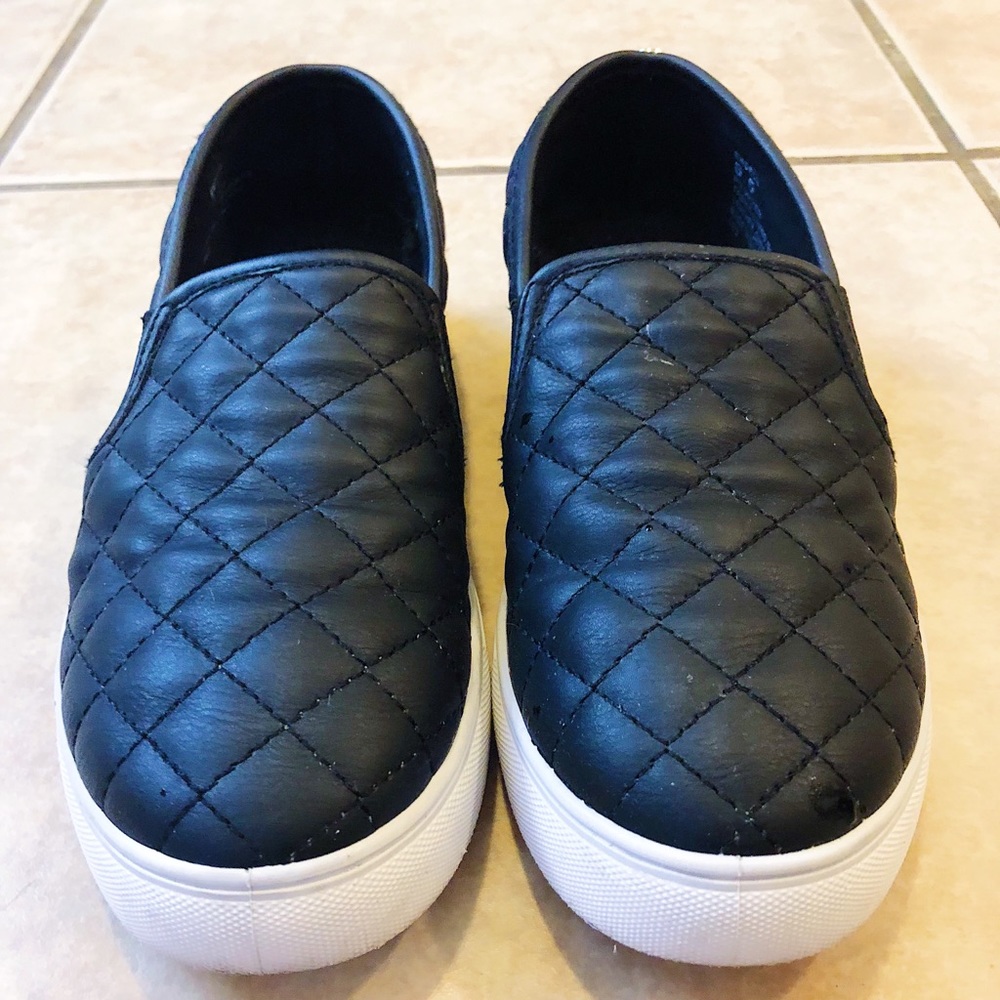 Steve Madden Black quilted slip on shoes.